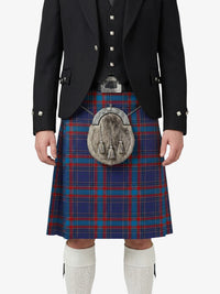 Person wearing a traditional Scottish kilt with a tartan pattern on a white background