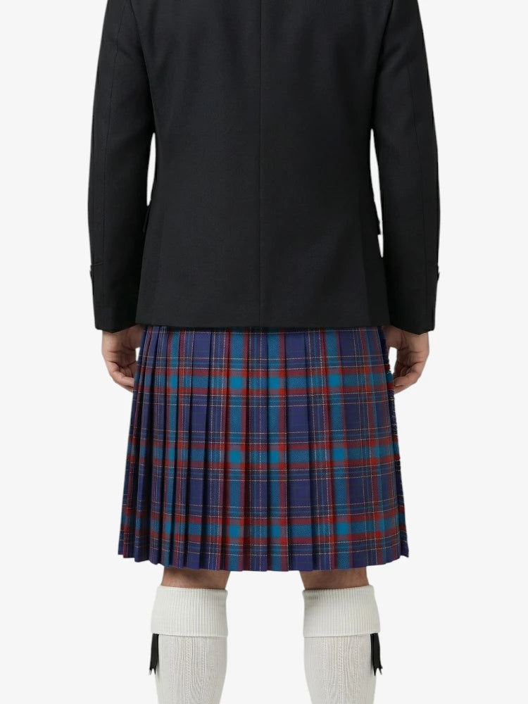 Person wearing a black coat and blue plaid kilt on a white background
