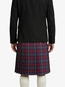 Person wearing a black jacket and red plaid skirt on a white background