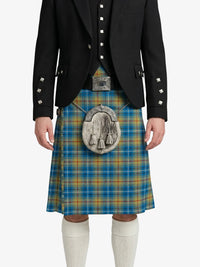 Person wearing a black jacket, blue plaid kilt, and white knee-high socks on a white background