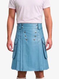 A person wearing a light blue faux-leather kilt with silver-tone double-breasted buttons and side flap pockets, paired with a pale pink t-shirt against a light gray background.
