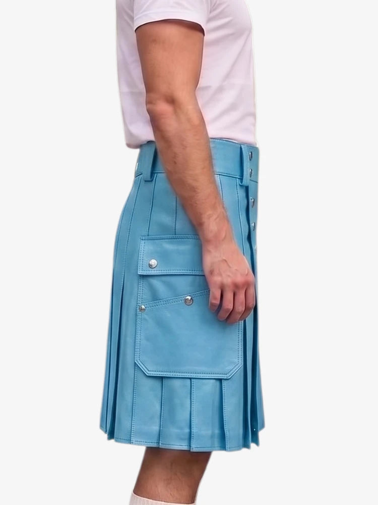 A person wearing a light blue pleated kilt-style skirt with flap pockets and silver snap details, paired with a white t-shirt, shown against a plain light background.