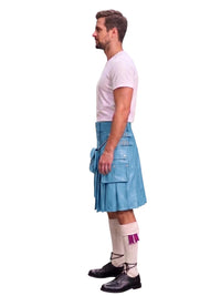 A man shown in profile wearing a light blue leather kilt, a white t-shirt, white knee-high socks with a purple accent, and black leather shoes, set against a plain white background.