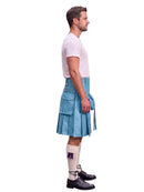 A man shown in profile wearing a light blue leather kilt, a white t-shirt, white knee-high socks, and black leather shoes, isolated on a white background.