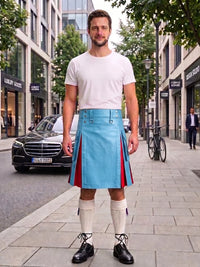 A man stands on a city sidewalk wearing a bright blue leather kilt with red side panels, a white t-shirt, white knee-high socks, and black leather shoes. Buildings, trees, a black Mercedes, and a bicycle are visible in the background.