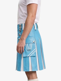 A person wearing a light blue pleated kilt with white diagonal stripe details, silver-tone decorative buttons, and a white t-shirt, shown from the side against a plain light background.