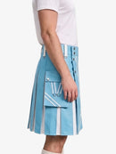 A light blue pleated kilt with white geometric stripe accents and silver-tone hardware, shown on a model wearing a white t-shirt against a plain white background.