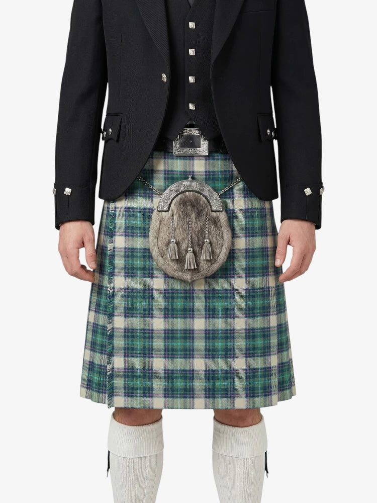 Person wearing a traditional Scottish kilt with a tartan pattern on a white background