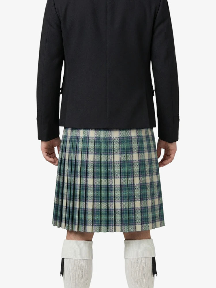 Person wearing a black jacket and plaid kilt on a white background