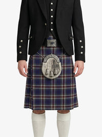 Person wearing a black jacket and plaid kilt with a silver sporran on a white background