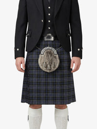 Person wearing a traditional Scottish kilt with a sporran on a white background