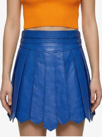 Blue pleated skirt worn by a person on a white background