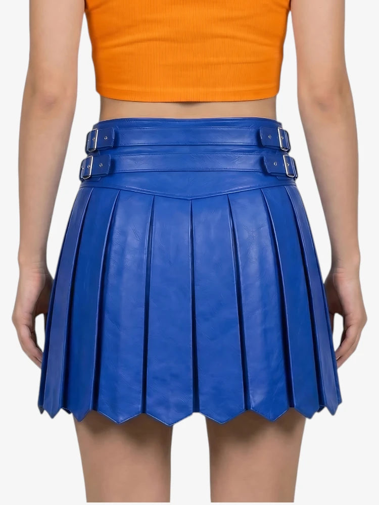 Blue pleated skirt worn by a person on a white background