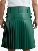 Green pleated skirt worn by a person on a white background