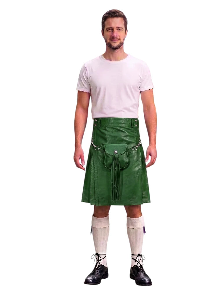 A man modeling a green faux-leather kilt with a matching belt and pouch, styled with a white t-shirt, white knee-high socks, and black shoes against a white background.