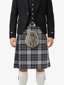 Person wearing a traditional Scottish kilt with a patterned sporran on a white background
