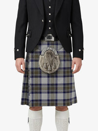 Person wearing a traditional Scottish kilt with a patterned sporran on a white background