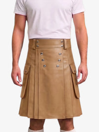 A tan faux-leather kilt with silver-tone metal snap buttons and side flap pockets, worn by a model in a white t-shirt against a light gray background.