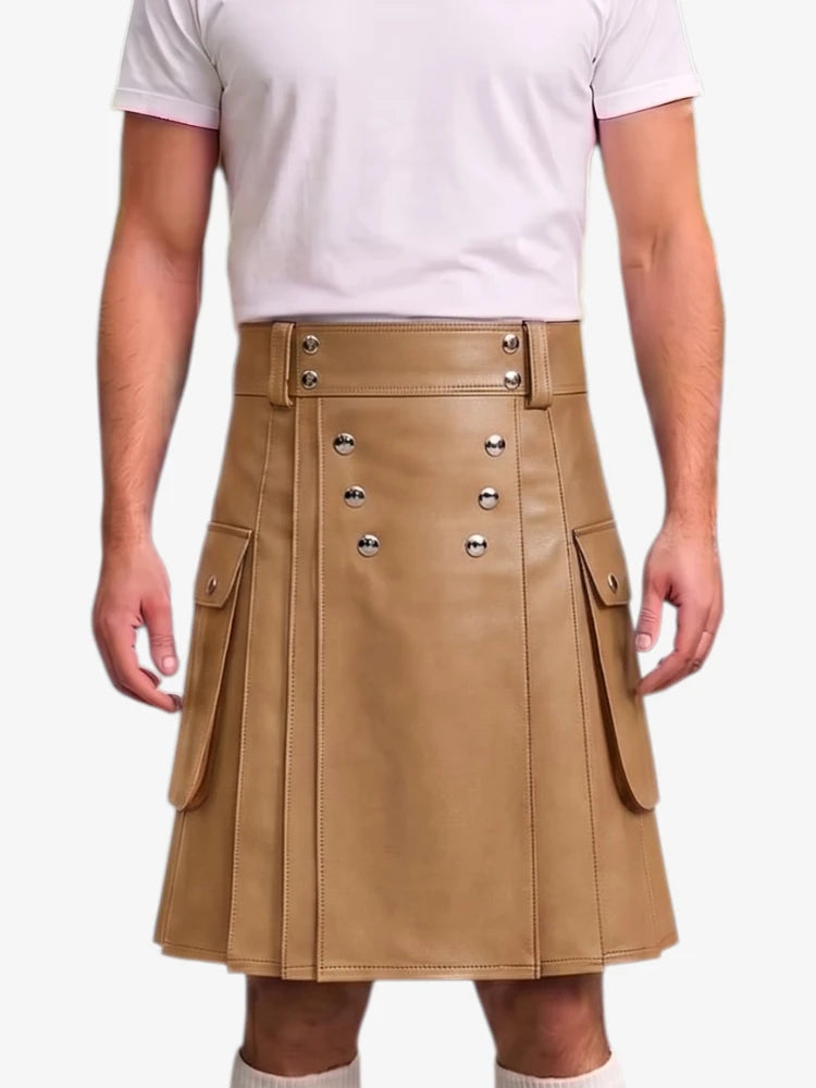 A tan faux-leather kilt with silver-tone metal snap buttons and side flap pockets, worn by a model in a white t-shirt against a light gray background.