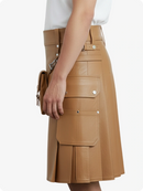 Tan leather skirt with multiple pockets on a white background