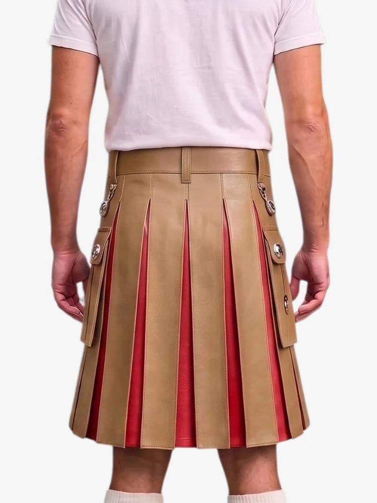 A man wearing a tan pleated leather kilt with red lining and silver-tone decorative hardware, paired with a light pink t-shirt, shown from the back against a light gray background.