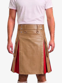 A man wearing a tan faux-leather kilt with red pleated side panels and a matching belt, paired with a light pink t-shirt against a white background.