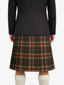 Person wearing a dark coat and plaid kilt on a white background