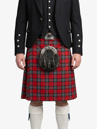 Person wearing a black jacket and red plaid kilt with a sporran on a white background