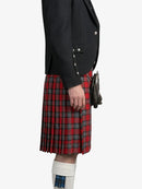 Person wearing a black jacket and red plaid kilt on a white background