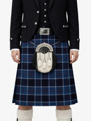 Person wearing a traditional Scottish kilt with a sporran on a white background