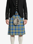 Person wearing a blue and yellow plaid kilt with a black jacket on a white background