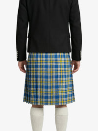 Person wearing a black jacket and blue and yellow plaid kilt on a white background