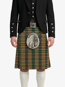 Person wearing a traditional Scottish kilt with a tartan pattern on a white background