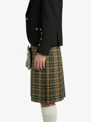 Person wearing a black jacket and plaid kilt on a white background