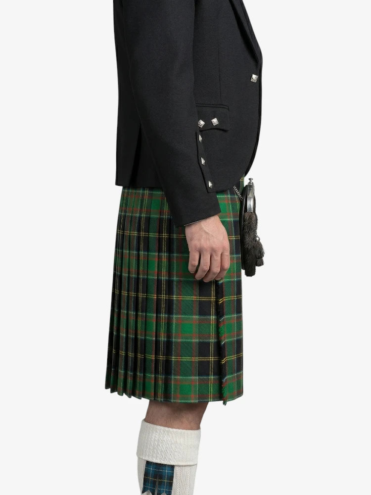 Person wearing a black jacket and green plaid kilt on a white background