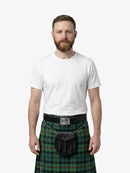 Man wearing a green plaid kilt with a white shirt on a white background