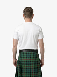 Man wearing a green plaid kilt with a white shirt on a white background