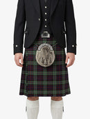 Traditional Scottish kilt with a tartan pattern worn by a person on a white background