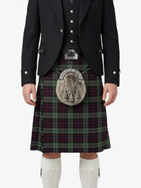 Traditional Scottish kilt with a tartan pattern worn by a person on a white background