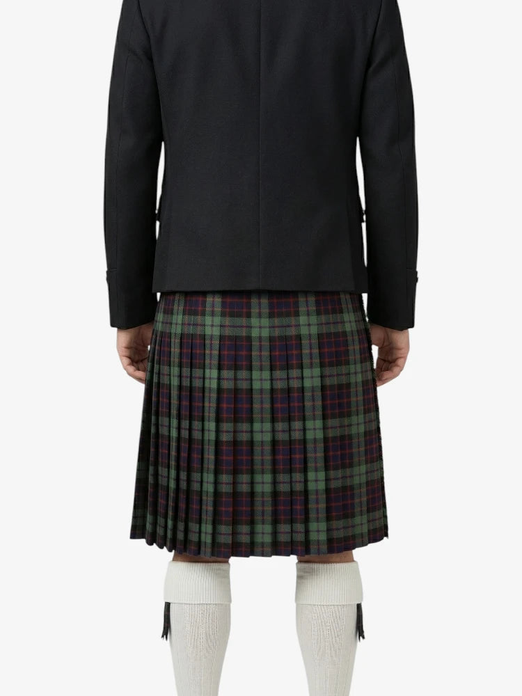 Person wearing a black jacket and plaid kilt on a white background