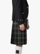 Person wearing a black jacket and plaid kilt on a white background