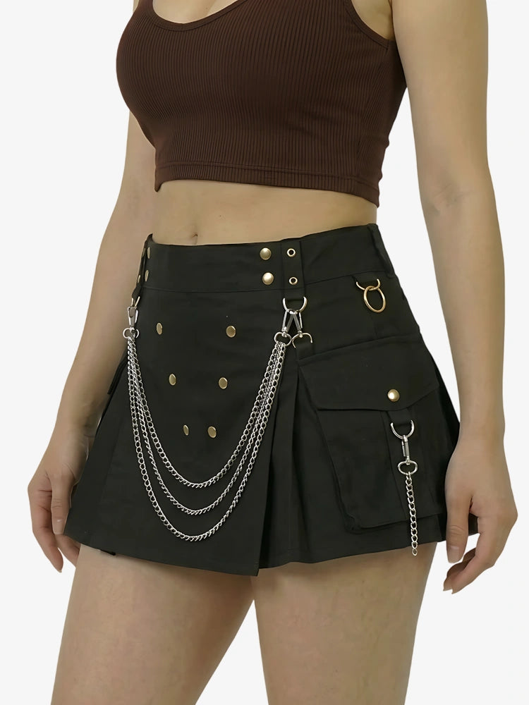 Black skirt with chain details worn by a person on a white background