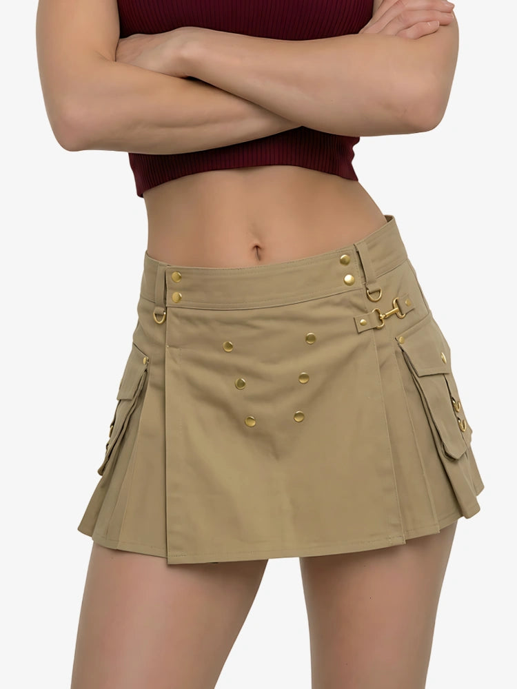 Person wearing a beige skirt with gold buttons on a white background