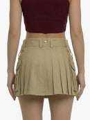 Beige pleated skirt worn by a person on a white background
