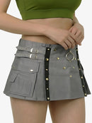 Gray skirt with decorative straps and buckles on a plain background