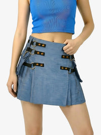 Blue pleated skirt with decorative straps worn by a person on a white background