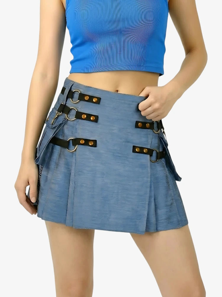 Blue pleated skirt with decorative straps worn by a person on a white background