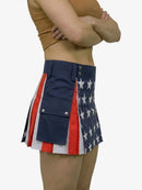 Person wearing a skirt with American flag design on a white background