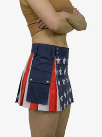 Person wearing a skirt with American flag design on a white background