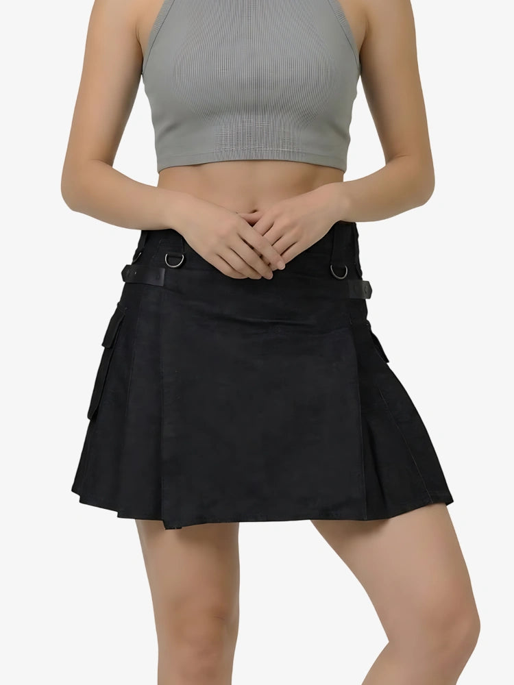 Person wearing a black skirt and gray crop top on a white background